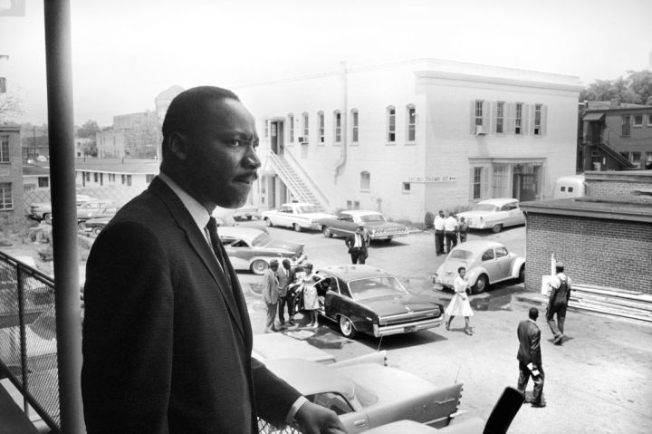 Martin Luther King standing on balcony at A. G. Gaston Motel overlooking parking lot, during Birmingham Campaign, Birmingham, Alabama, USA, Marion S. Trikosko, US News & World Report Magazine Collection, May 16, 1963